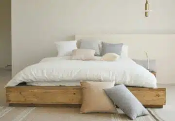 white bed pillow on brown wooden bed frame